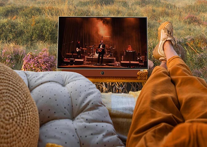 Skyworth Companion Portable 24P100 24-inch LED TV sits in a meadow