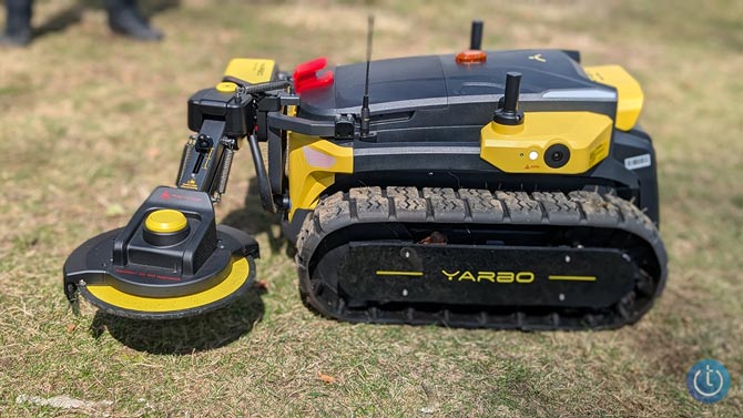 The Yarbo modular robot system is shown with the Yarbo Trimmer attachment.