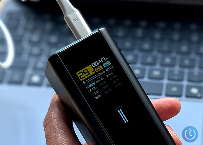 Closeup of the Cucktech 15 Ultra's display while powering a laptop.