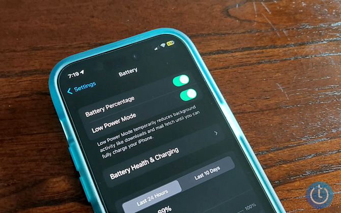 iPhone 14 Pro battery settings screen battery percentage and low power mode turned on and showing battery percentage with yellow fill in status bar.