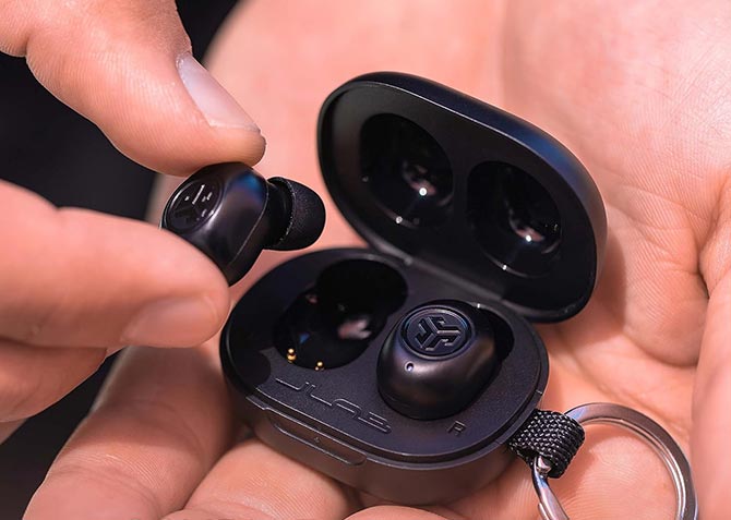 JLab JBuds Mini are shown in a hand